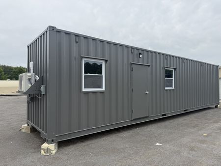 A Rebox 40' ground level office with two windows and a steel entry door