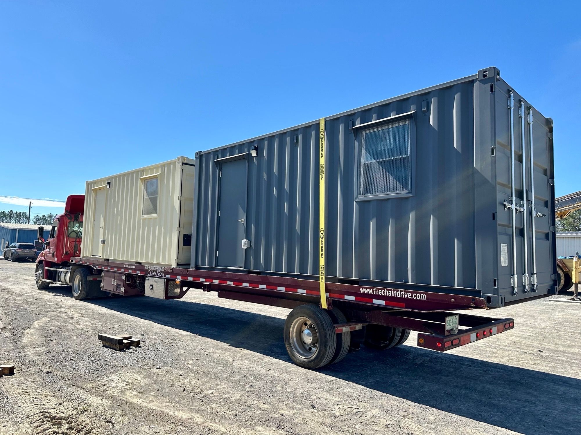 Two Rebox mobile offices loaded on a truck for delivery.