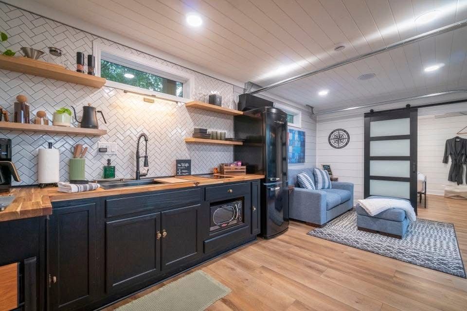 Interior view of the kitchen and living room space in a custom Rebox Solutions container.